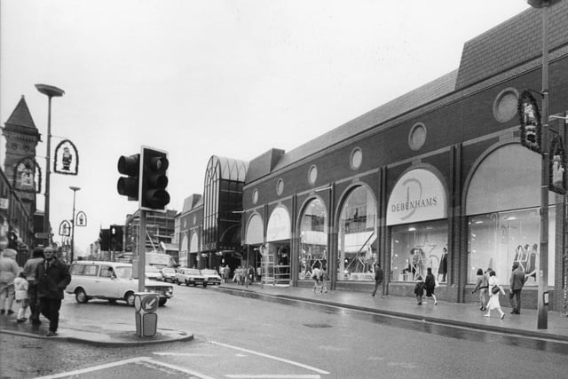 The busy junction at Fishergate and Corporation Street gives a good view of the large Debenhams store in 1990