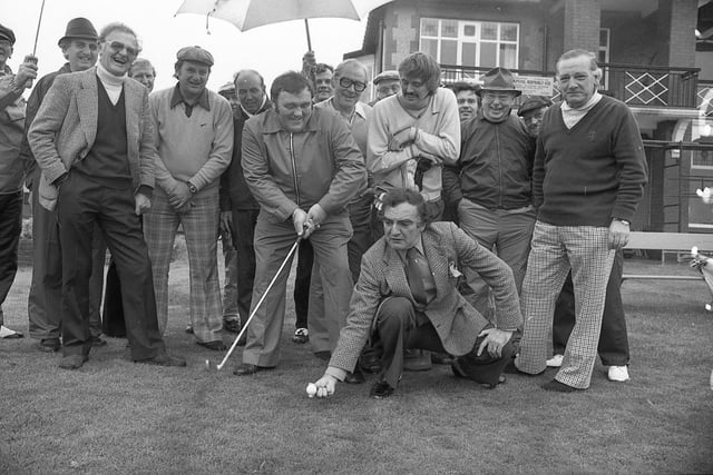 Les Dawson and Billy Dainty get in the right spirit at the start of the celebrity match at Fairhaven Golf Club, watched by other competitors including Preston comedian Walter Horam and one of the Bachelors. The tournament was sponsored by Les and was in aid of the Artists' Benevloent Fund