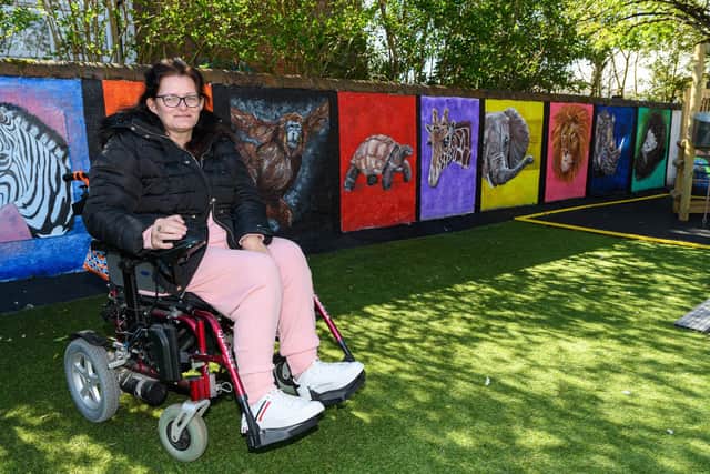 Artist Kirsty Rea in front of her zoo-themed mural at Ashcroft Nursery in Blackpool. Photo: Kelvin Stuttard
