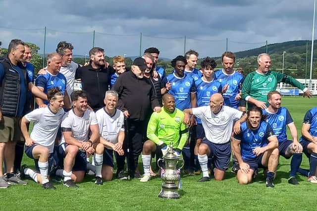 Players from both teams pose for a photo at the end of the game. Credit: Longridge Town