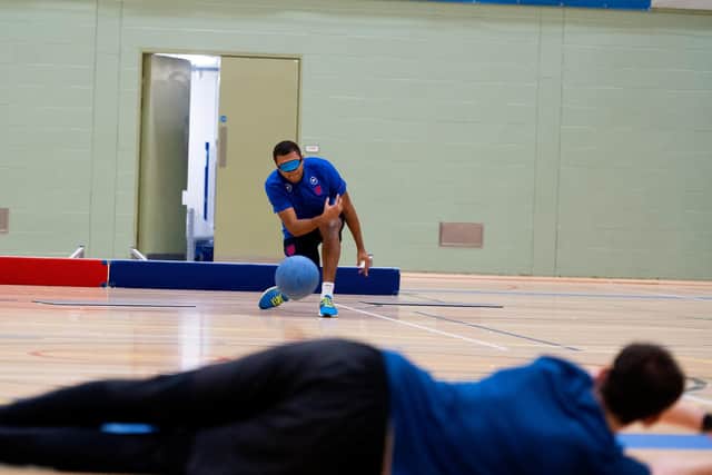 In goalball, players (all wearing eyeshades) have to throw the ball along the floor into the opposition’s goal while defending their own goal.
