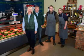 (l-r) Kathy, John and Danny Woods with Dave Shaworth inside Woods Farm Shop, which suffered from a bird flu outbreak last week.