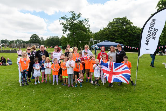 Children from Marathon Kids with their medals following the completion of thier Platinum Jubilee Run at Astley Park