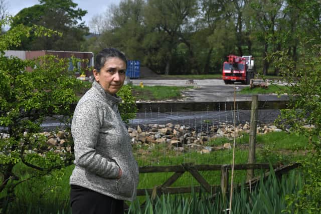 Protestor Dr Sheila Cromie is pictured in front of the snail farm and holiday lodge site in Ribchester