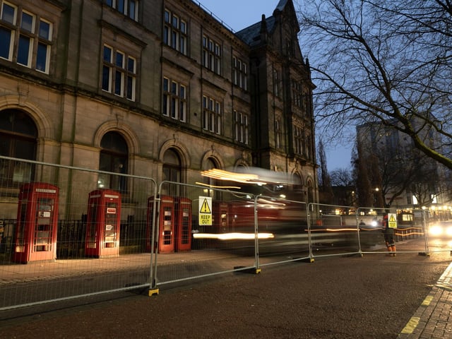 Dawn breaks over the phone boxes on Market Street for the last time until the spring