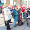Fundraisers serenaded the shoppers in town.