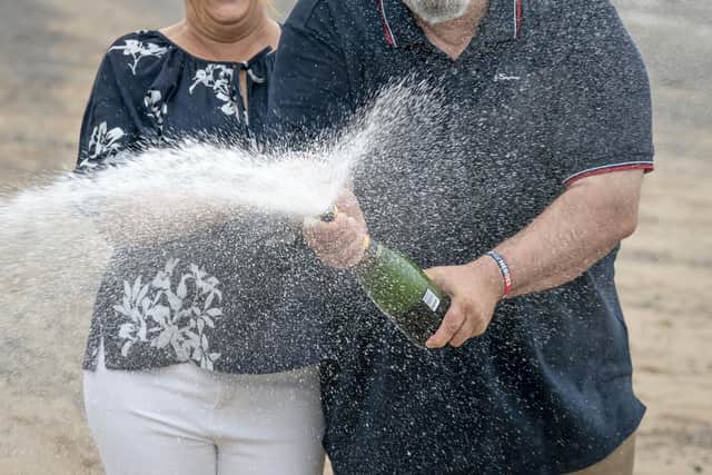 Helen and Lee Kuchczynski, from Cumbria, during a photo call to celebrate their £3.6 million EuroMillions win, in Morecambe, Lancashire. Picture date: Friday July 22, 2022. PA Photo. See PA story LOTTERY EuroMillions. Photo credit should read: Danny Lawson/PA Wire