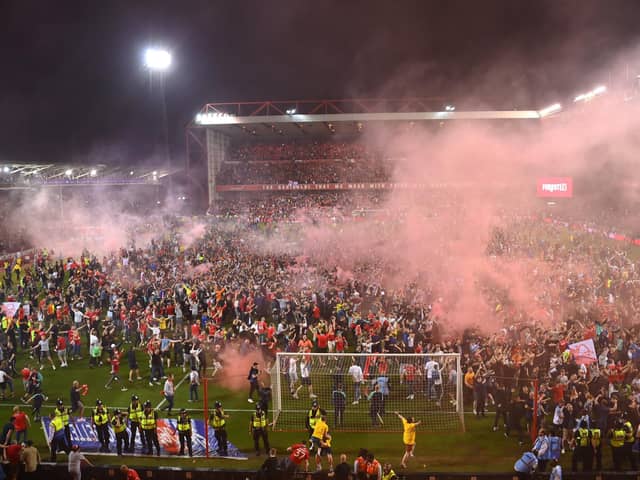 Nottingham Forest fans invade the City Ground pitch after their penalty shoot-out win over Sheffield United. Pic: Getty Images