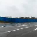 The blue hoarding surrounding the former Frontierland site on Morecambe Promenade. Photo: Kelvin Stuttard.