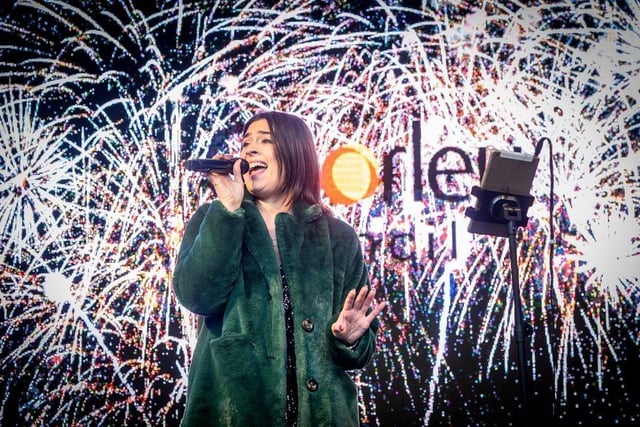 Singer Just Giorge performs for the crowds