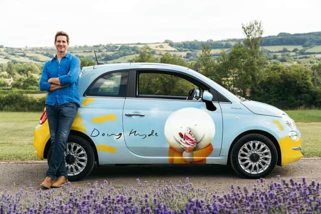 Artist Doug Hyde and the distinctive Fiat 500 car which could be won by purchasers of his art