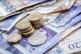 A woman who callously drained her father's bank account while he was seriously ill in hospital has been sent to prison by a judge.


