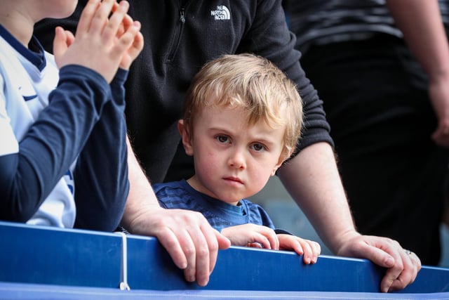A young Preston North End fan watches on