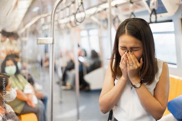 Being trapped in an overcrowded train carriage is no fun when people start coughing. Photo: Adobe