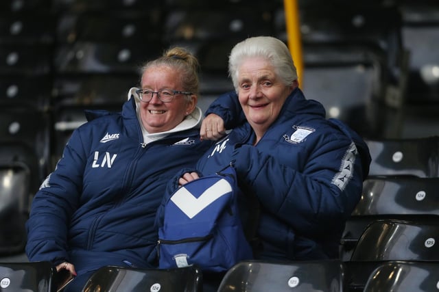 A couple of North End fans smile for our camera after arriving early to Fulham.