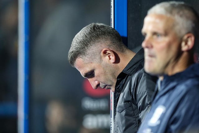 Preston North End manager Ryan Lowe takes a seat in the dug out.