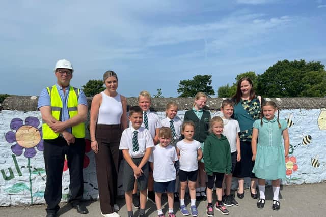 Site Manager at Create Homes’ St. William’s Gate development Jason Dandy with Regional Sales Manager Georgia Bridge, the acting headteacher Pilling St John’s CE Primary School, Lisa Hill, and pupils.