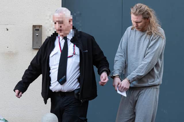 Daniel Godkin is led away from Preston Magistrates Court after being remanded in custody. Photo: Kelvin Stuttard