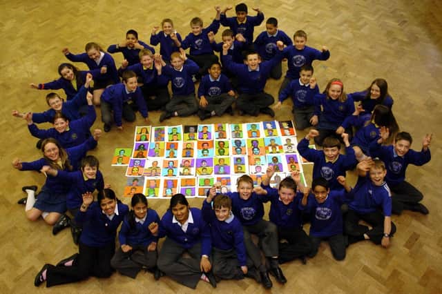 Year six pupils from Queens Drive Primary School with their Andy Warholes art work