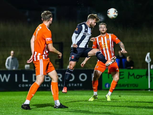 Ollie Shenton heads home in the 9-0 rout of Liversedge on Tuesday (photo: Stefan Willoughby)
