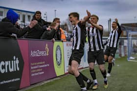 Chorley's Mike Calveley celebrates with visiting fans and team-mates after his dramatic late winner against Macclesfield (Photo: David Airey/dia_images)