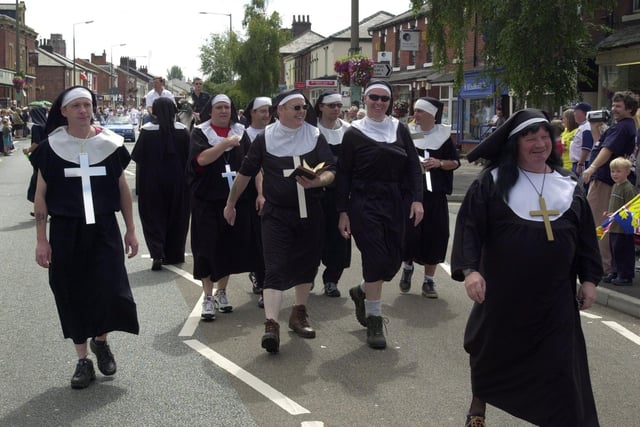 Nuns tour the streets of Bamber Bridge behind the Preston North End coffin after it was raised to celebrate their promotion to Division 1