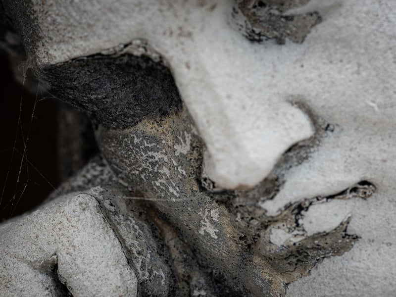 Thucydides reclines at the angle of the pediment, meditating upon history yet to be written