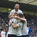 Preston North End's Craig Davies celebrates scoring his first and his sides fourth goal with team-mates Scott Laird, Alan Browne and Keith Keane (top).