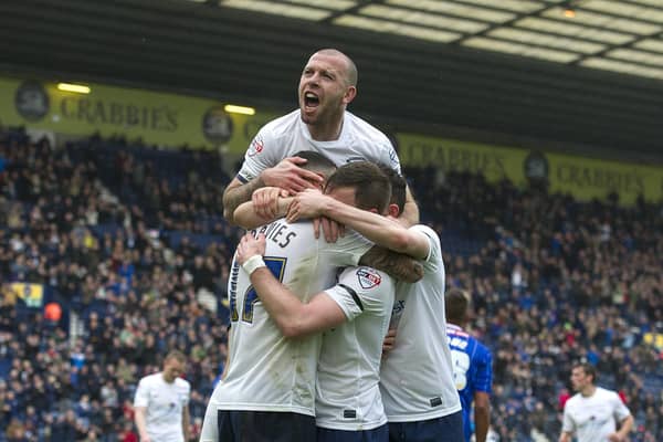 Preston North End's Craig Davies celebrates scoring his first and his sides fourth goal with team-mates Scott Laird, Alan Browne and Keith Keane (top).