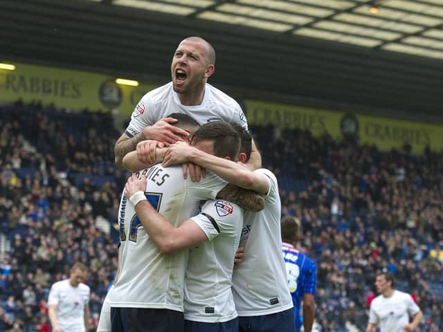 Preston North End's Craig Davies celebrates scoring his first and his sides fourth goal with team-mates Scott Laird, Alan Browne and Keith Keane (top).