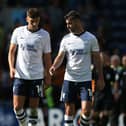 Preston North End's Jordan Storey (left) and Andrew Hughes chat on the pitch at Luton Town.