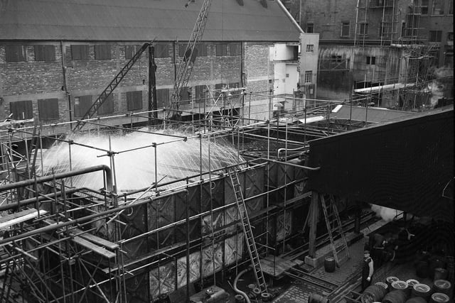 A fountain of water, brought from Union Canal for cooling, at Scottich Breweries' Fountain Brewery in October 1959.