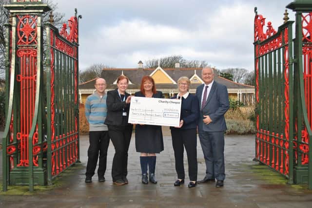 Alison Wright and Mark Smith, Eric Wright Group, present cheque to Age UK Lancashire