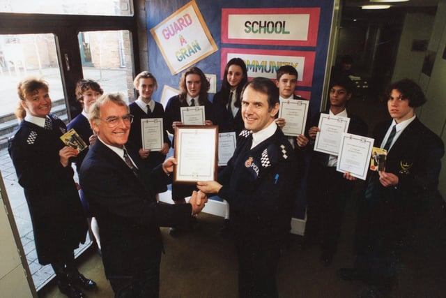 In 1994 The School Community Action Team at All Hallows RC High School in Penwortham were presented with special certificates of achievements for their work - including a special Guard-a-Gran campaign. Pictured: Chief Inspector David Jones presents the certificates to Joe Green at the school, with PC Julie Walker, Jenny McGuinness, Becky Walton, Rachel Wright, Laura Davenport, Danny Parry, Mitesh Chauhan and John Dempsey