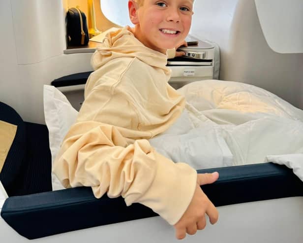 James Meconi enjoying business class to NYC for his 9th birthday as guest of Global Airlines