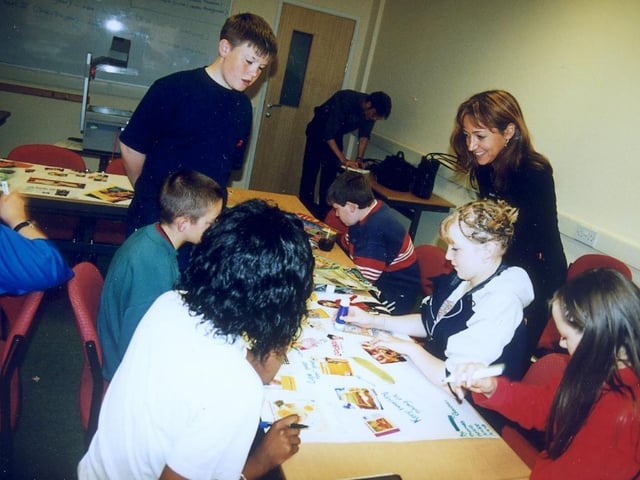 Ribbleton Hall High School pupil Gordon Quinn helps create a collage with other play scheme participants at one of the Summer School Workshops held there in the year 2000