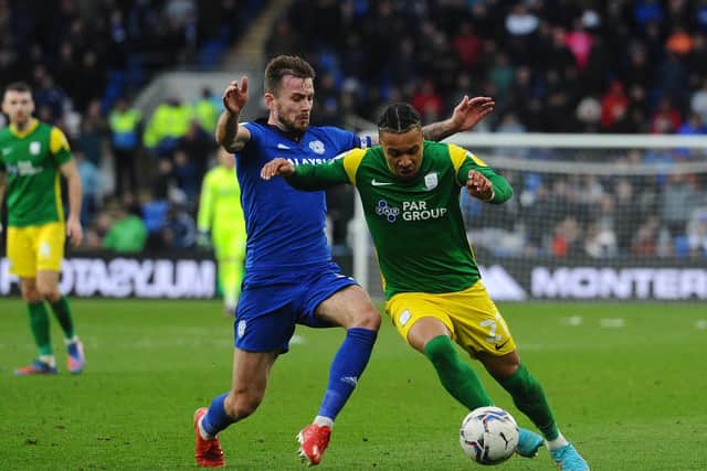 Preston North End striker Cameron Archer battles with Cardiff City's Will Vaulks