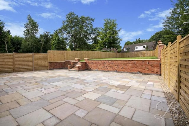 Imagine hosting get-togethers on a warm summer evening on this large patio area, which forms part of the back garden.