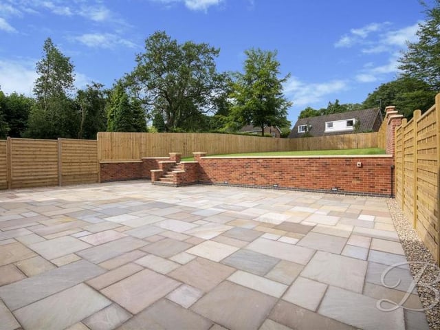 Imagine hosting get-togethers on a warm summer evening on this large patio area, which forms part of the back garden.