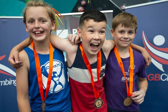 Gaining a gold  - Alexander Watson, pictured centre, on the winners' podium at the English Lead Climbing Championships 2022 in Southampton