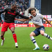 Alvaro Fernandez crosses the ball under pressure from Stoke City’s Dujon Sterling