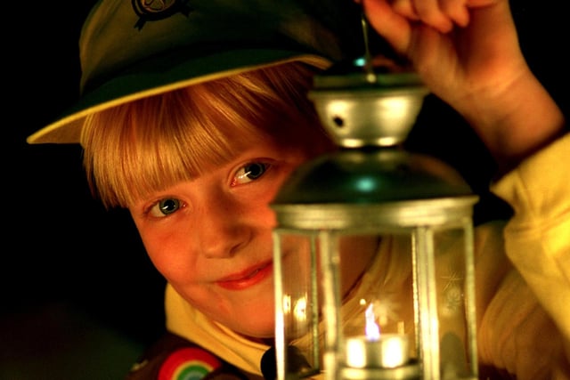 A member of the 2nd Longton St Andrew's Brownie, Sarah Wyllie, seven, from Walmer Bridge, near Preston, with the Bethlehem Peace Light during a meeting at St Andrew's Church Hall in Longton, near Preston in 1997