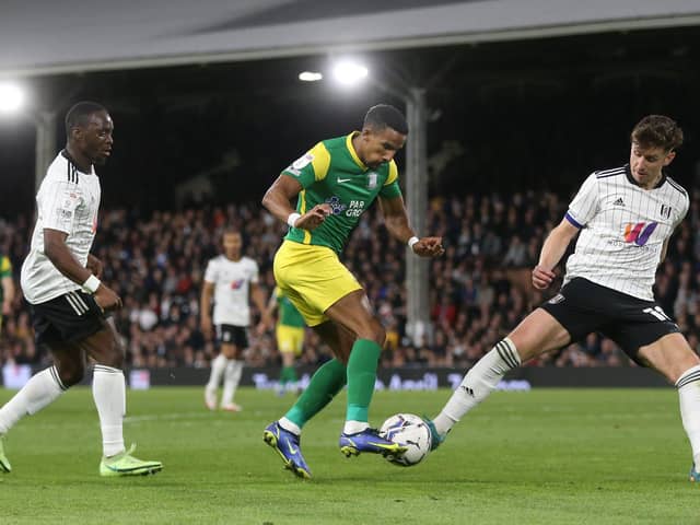 Preston North End winger Scott Sinclair takes on Fulham's Tom Cairney