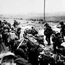 British soldiers moving off the Normandy Beaches on D-Day during the advance inland from ‘Sword’ beach, Photo: PA Wire