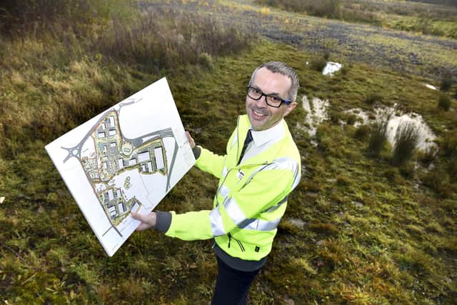 County Cllr Aidy Riggott with the plans for Lancashire Central