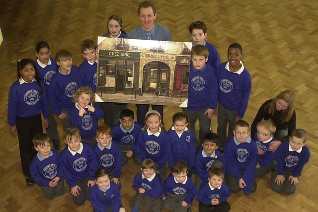 Head teacher John Dalglish being presented with his leaving present at Queens Drive Primary School in 2003