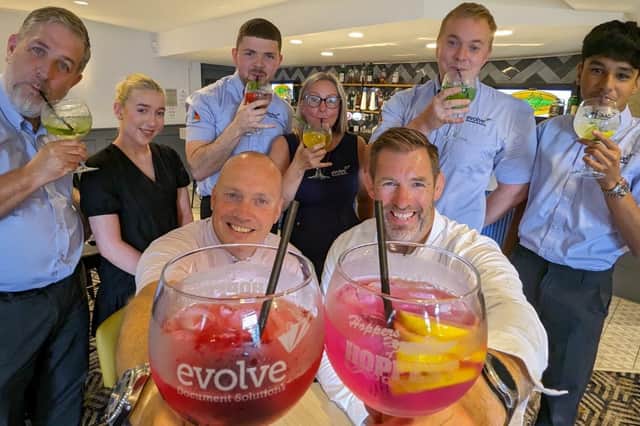 Preston Grasshoppers  and Evolve Document Solutions staff toast the new HopFest gin glasses 