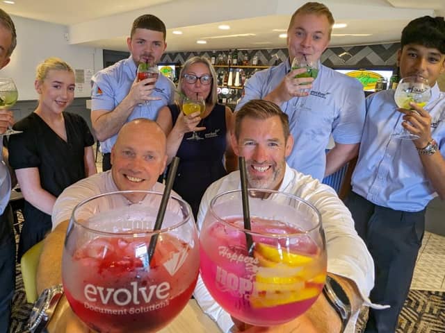 Preston Grasshoppers  and Evolve Document Solutions staff toast the new HopFest gin glasses 