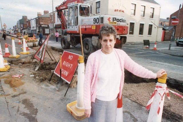 Shops and businesses along this stretch of Ribbleton Lane in 1990 were angry at lengthy road resurfacing works that had slashed their profits. Pictured is Pat Chadwick, manager of printer Lake Prints North West