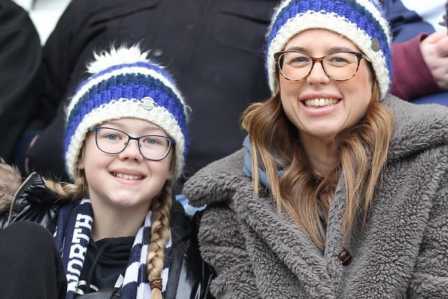 Two PNE fans sport the same North End bobble hats